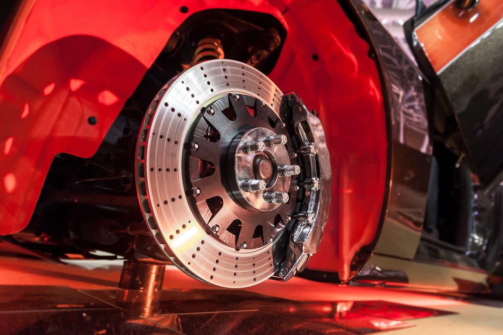 Hands,Of,Car,Mechanic,InBrake,Disk,And,Detail,Of,A,Wheel,Hub Hands,Of,Car,Mechanic,In