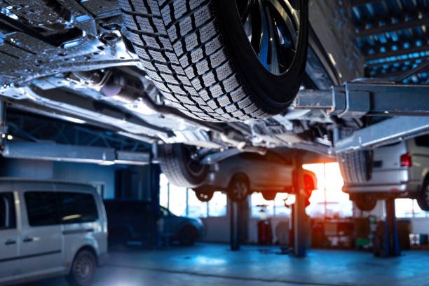 Mega Auto service interior background with cars on the lift. Mega Auto service interior background with cars on the lift.